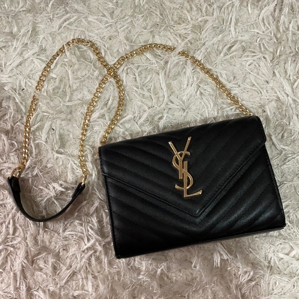 Brand new black bag with removable chain.